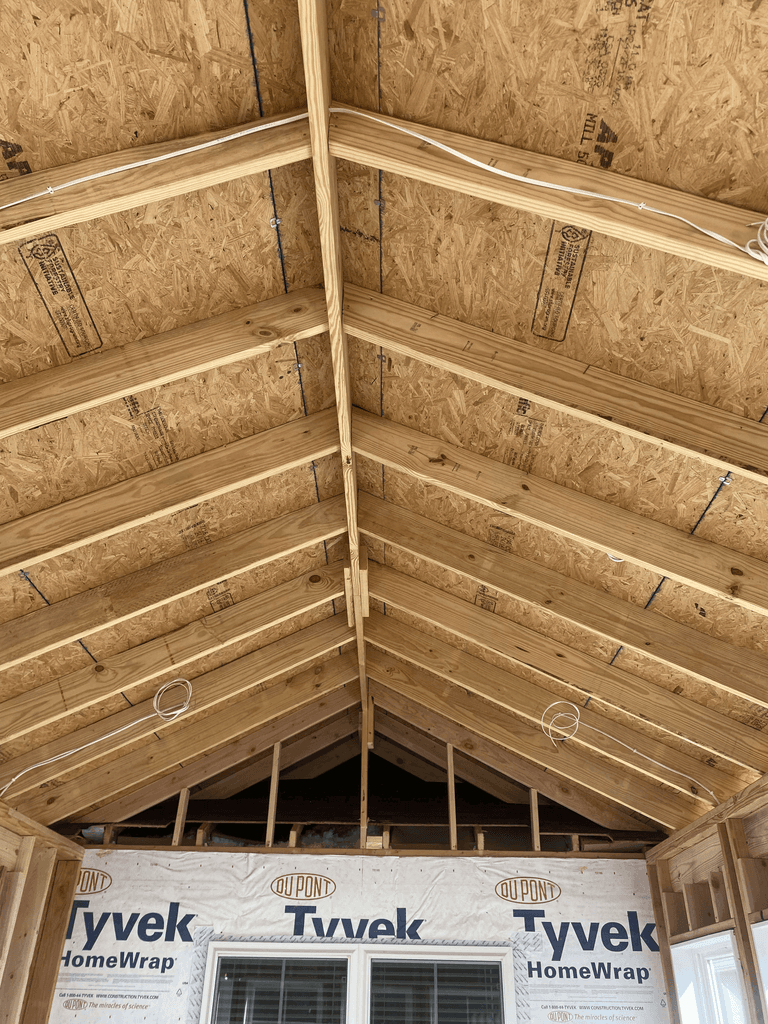 Close view of rafters and roof sheathing inside the sunroom addition