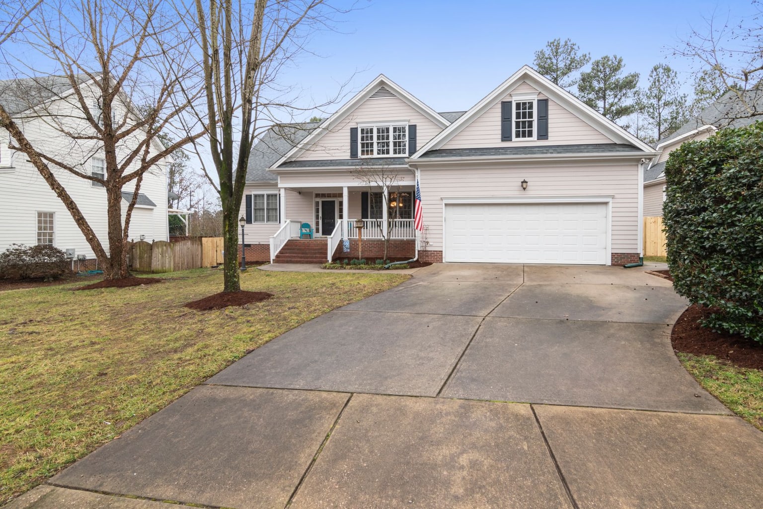 Home with coordinated siding, soffit, fascia, gutters and exterior trim