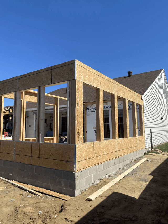 Sunroom addition at the initial framing and sheathing stage